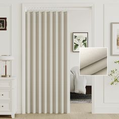 an image of a living room with white furniture and curtains on the window sill