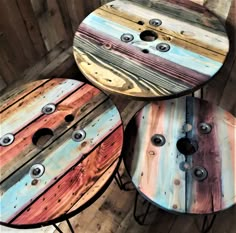 three round tables made out of wooden boards