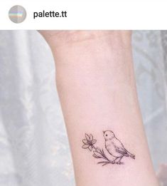 a small bird tattoo on the ankle