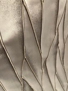 close up view of metallic fabric with wavy lines