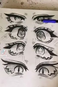 the eyes are drawn on paper with markers