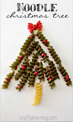 a christmas tree made out of pasta noodles with red bows on it and the words noodle christmas tree