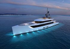 a large white boat floating on top of the ocean next to a ship with lights