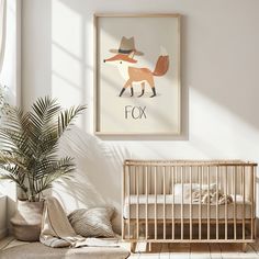 a baby's room with a fox print on the wall