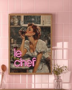 a woman drinking from a wine glass with the words le chef on it in front of a pink tiled wall