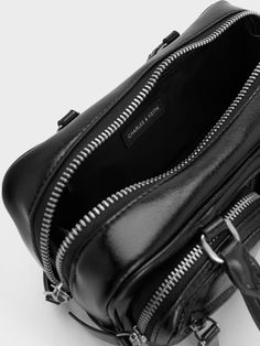 If you are someone who needs your bag to be neat and organised, this Thora bowling bag will be just your cup of tea. In sleek black, this style-meets-function carrier comes with two external pockets and an inner compartment so your belongings can be easily accessible -- no more rummaging required. Carry it by its top handles or clip on the accompanying adjustable strap to go hands-free when you want to. It also come with a keychain that doubles as a bag charm. Bowling Bag, Bowling Bags, Charles Keith, Kids Gifts, You Bag, Bowling, Hands Free, Luggage Bags, Clip On