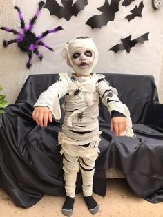 a small child dressed up as a skeleton