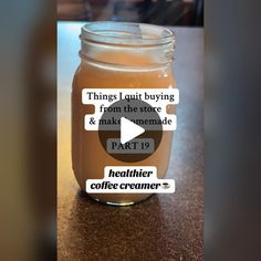 a jar filled with liquid sitting on top of a table