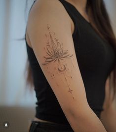 a woman's arm with a flower and stars tattoo on the left side of her arm