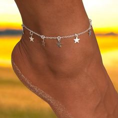 The Simple Star Fashion Anklet is a sleek and modern accessory that effortlessly complements any style. Featuring a subtle star design, this metal anklet is the perfect choice for those who appreciate minimalist elegance. Its lightweight construction makes it comfortable for everyday wear, adding a touch of understated chic to any outfit. Whether you're heading out for a casual walk or attending a special event, this anklet enriches your look with a delicate, refined detail. Crafted from high-qu Adjustable Trendy Metal Anklets, Trendy Adjustable Metal Anklet, Elegant Adjustable Metal Anklets, Trendy Adjustable Heart Anklets, Adjustable Heart-shaped Metal Anklet, Star Anklet, Trendy Fashion Jewelry, Modern Accessories, Anklet Jewelry