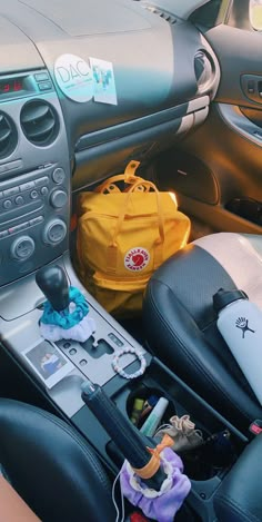 the interior of a car with various items in it