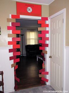 the hallway is decorated with red and white strips that are stacked high on each other