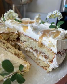 a piece of cake with white frosting and flowers