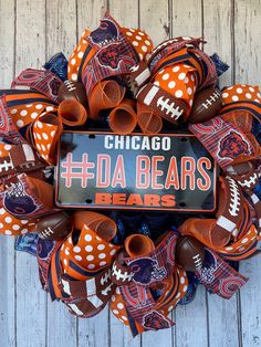 the chicago bears football deco mesh wreath is decorated with orange and white polka dot ribbon