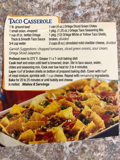 the menu for taco casserole is displayed on a granite counter top,