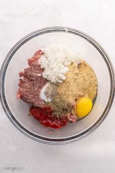 ingredients in a glass bowl to make meatloaf