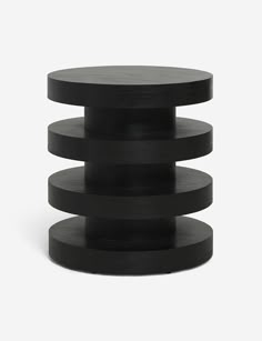 three tiered black table on white background