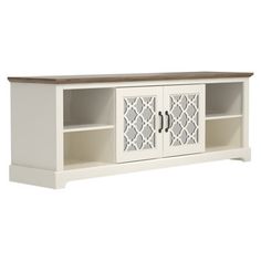 a white entertainment center with two doors and an open shelf on one side, in front of a white background