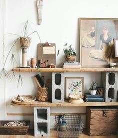 the shelves are filled with various items in baskets and vases on top of them