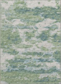 an area rug with green and blue colors