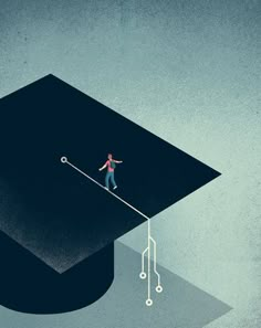 a man standing on top of a graduation cap