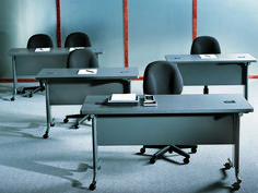 an empty classroom with desks and chairs