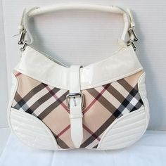 Make a bright statement in this lovely Authentic Burberry Phoebe Hobo handbag
Features Bright White quilted patent leather with Beige Nova Check PVC canvas.
Lovely staple Baguette perfect for everyday use.
Height: 9.8"
Width: 2.75"
Length: 14.9"
Callouts: Small spot marks on the white patent leather. slight wear on the trim by handle. Please see all pictures for condition and description . Sold as is. No Returns.
will come in non brand dust cover

$ 370 FIRM

#designer #luxury #handbag #DesignerBag #Burberry White Quilt, Burberry Women, Hobo Handbags, Dust Cover, Women Accessories Bags, Bright White, Patent Leather, Women's Bag, Burberry