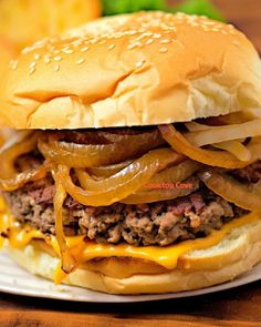 a cheeseburger with onions and onion on a plate