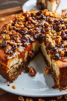 there is a cake with nuts on the top and one slice cut out from it