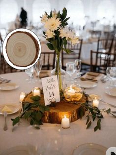 a centerpiece with flowers and candles is displayed on a round table in front of the tables