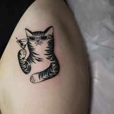 a black and white cat tattoo on the stomach