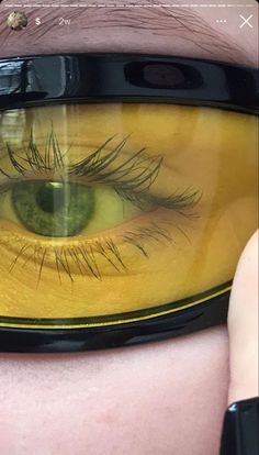 an eye looking through a pair of glasses