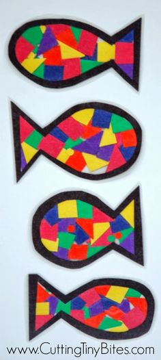 three fish made out of colored paper on top of a white surface with the words cuttin