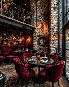 a restaurant with red velvet chairs and tables