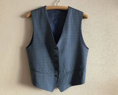 "Women's Vest Blue Womens Vest Blue Vest Formal Blue Linen Blend Women Waistcoat Edwardian Victorian Renaissance Steampunk Baroque  Label size: M Measurements (lying flat): Length(back): 20\"/ 51 cm Chest: 19.5\"/ 49.5 cm Waist: 18\"/ 46 cm Condition: great  Vintage Condition Material: 30%linen,30%polyester,40%viscose.Lining: 100%acetate N.B. Color may slightly differ from picture Please check measurements to insure a proper fit. Remember to allow yourself some extra room for movement. You can compare these with something from your closet that fits you well. SHIPPING * I ship worldwide via Priority mail  * Items are shipped 1 - 3 business days after receiving the payment. * I ship from Europe, so please allow 2 to 3 weeks for the package to arrive if you live overseas. * Europe 5 - 10 busi Formal Blue Vest With Buttons, Blue Buttoned Vest For Fall, Vintage Blue Vest For Fall, Elegant Blue Vest With Buttons, Formal Blue Vest For Spring, Blue Formal Vest For Spring, Fitted Blue Vest With Buttons, Tailored Sleeveless Blue Vest, Blue Fitted Vest For Fall