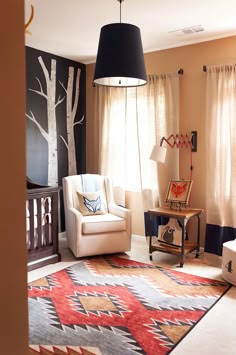 an image of a living room with furniture and rugs on the floor in it