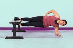 a woman is doing an exercise on a treadmill with one leg in the air