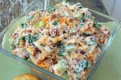 a glass bowl filled with food on top of a table