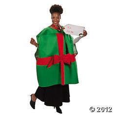 a woman in a green and red robe holding a sign