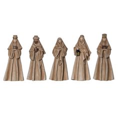 four figurines in the form of people with hats and cloaks on their heads