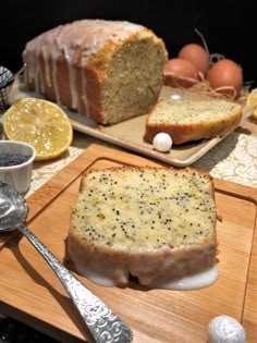 a loaf of lemon poppy seed bread on a cutting board