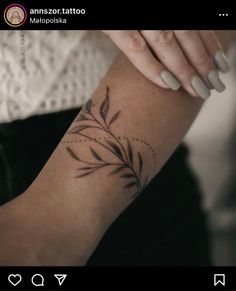 a woman's arm with a small tattoo on the left side of her arm