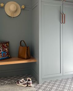 a pair of shoes and a purse on a shelf in a walk - in closet