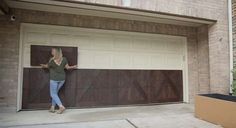 a woman standing in front of a garage door with her hand on the window sill