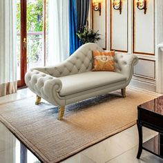 a living room filled with furniture and windows