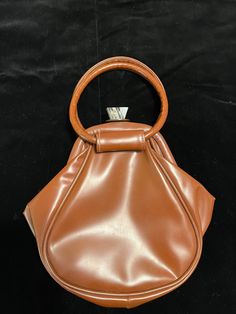 Vintage 60s funky brown vinyl handbag with lucite jeweled clasp.  Fabric lined interior.  Measures 9" x 9" and 1" wide. Top Handle Bags, Vintage Handbags, Vintage 60s, Vintage Bags, Bag Pattern, Purses And Handbags, Top Handle, Pattern Design, Top Handle Bag