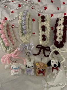 several crocheted keychains are arranged on a sheet