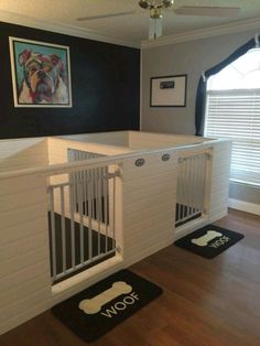 a white crib in the corner of a room with black and white rugs