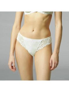 Simone Perele Wish Brief Panty 12B720 in ivory color - front Elegant Lace Bottoms With Lace Trim, Wedding Bottoms With Lace Trim String Shape, Elegant Stretch Lace String, Elegant Stretch String Lace, Elegant Stretch Lace Bottoms, Elegant Bottoms With Delicate Lace And Stretch, Elegant Stretch Bottoms With Delicate Lace, Fitted Cream Bottoms With Lace Trim, Feminine Wedding Bottoms With Lace Trim