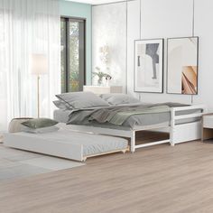 a bedroom with white walls and wood floors has a bed, nightstands, and window